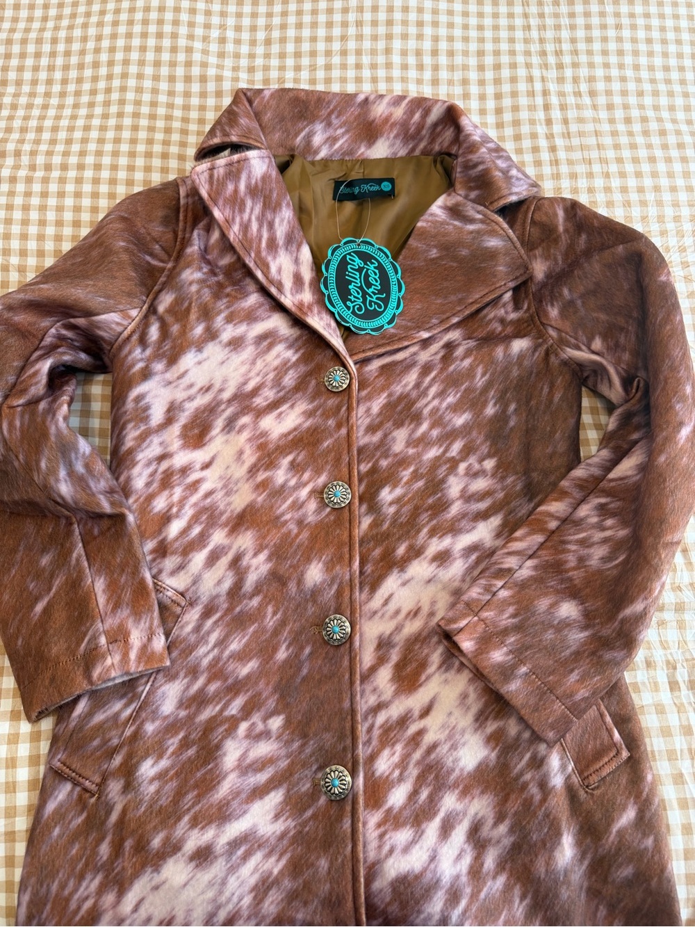Brown and white long cowhide print coat with turquoise and silver Concho buttons